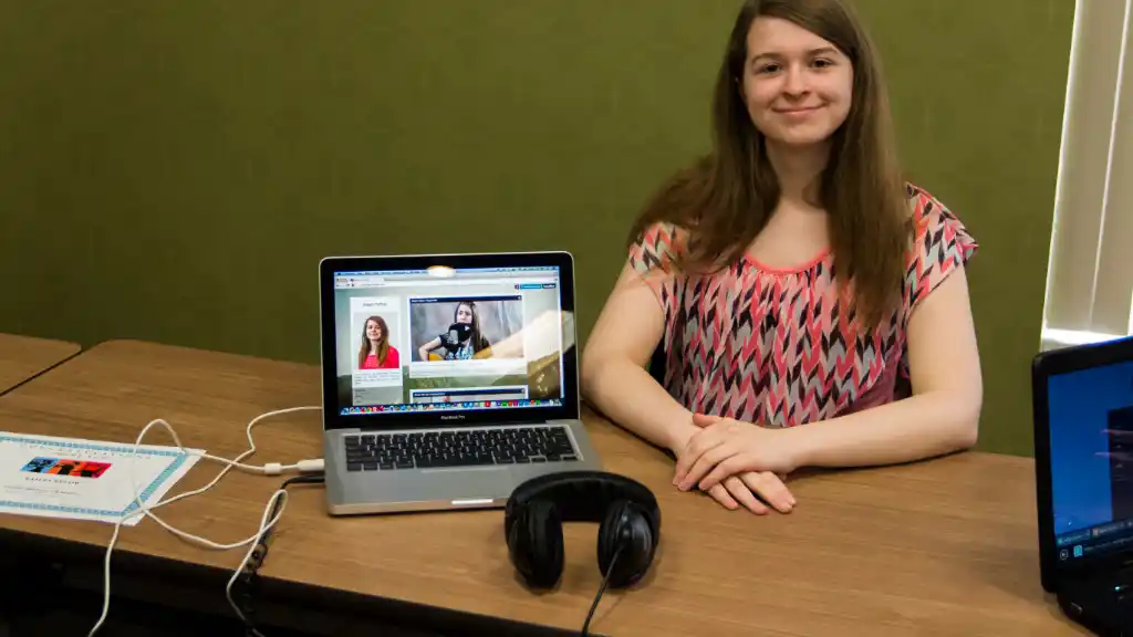 girl next to laptop